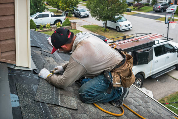 Professional Roofing technician working in North Conway, NH